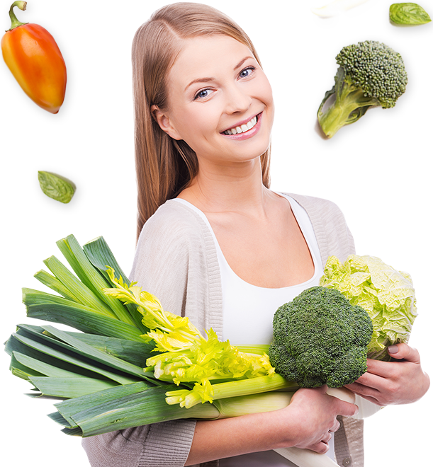 Woman holding broccoli and leeks
